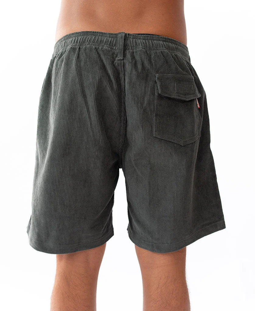 Rear view of a person wearing Floyd Cord Elastic Waist Walkshort | Wash Black made from corduroy fabric, featuring an elastic waistband and a back flap pocket, styled for casual surfwear.