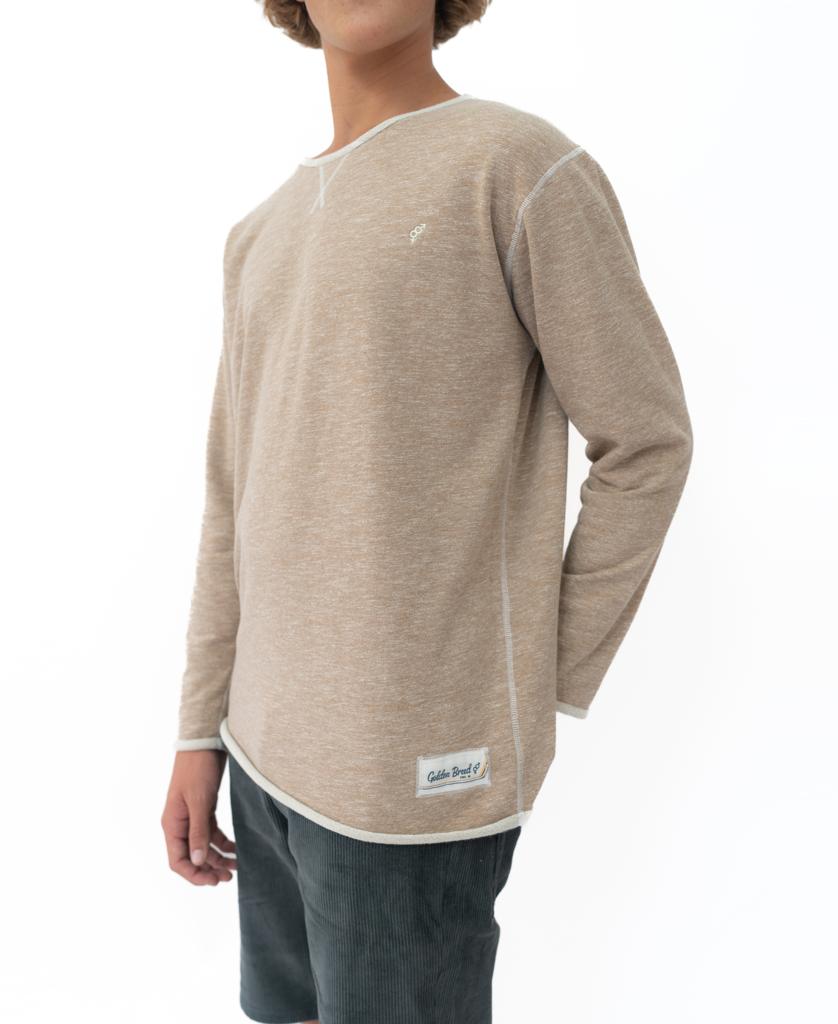 A person wears a Golden Breed Classic Rag Top in Coffee Marle, paired with dark shorts, standing against a plain white background.