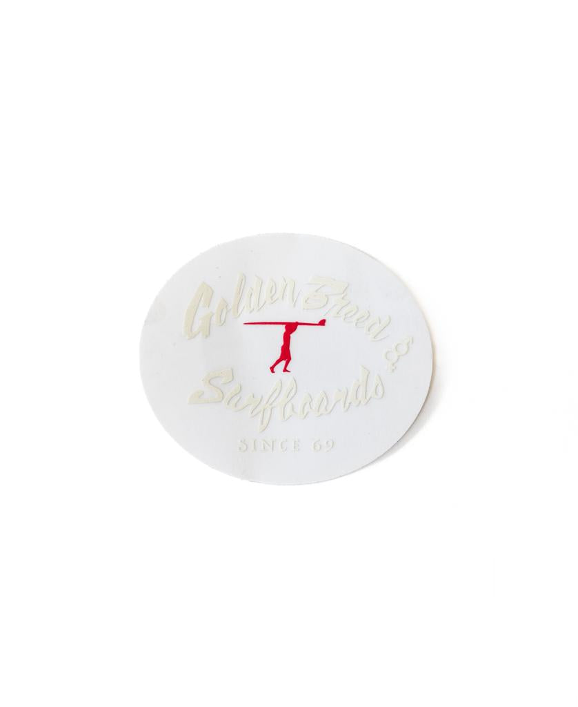 A clear round GB Dude Sticker by Golden Breed, featuring Golden Breed Surfboards Since 69 and a red surfboard guy silhouette.