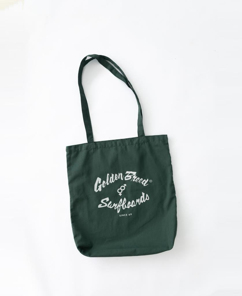 The Golden Breed Surf Logo Tote Bag in Ivy Green features a classic white Surfboards Since 69 logo on cotton, shown against a white background.