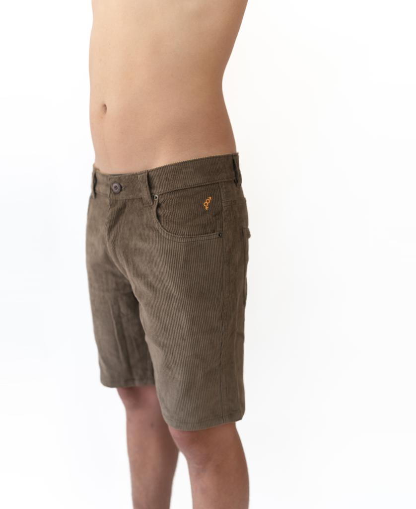 A person stands with arms raised, torso visible, against a plain white background, wearing Golden Breed’s Floyd Cord Walkshort in Wash Brown.