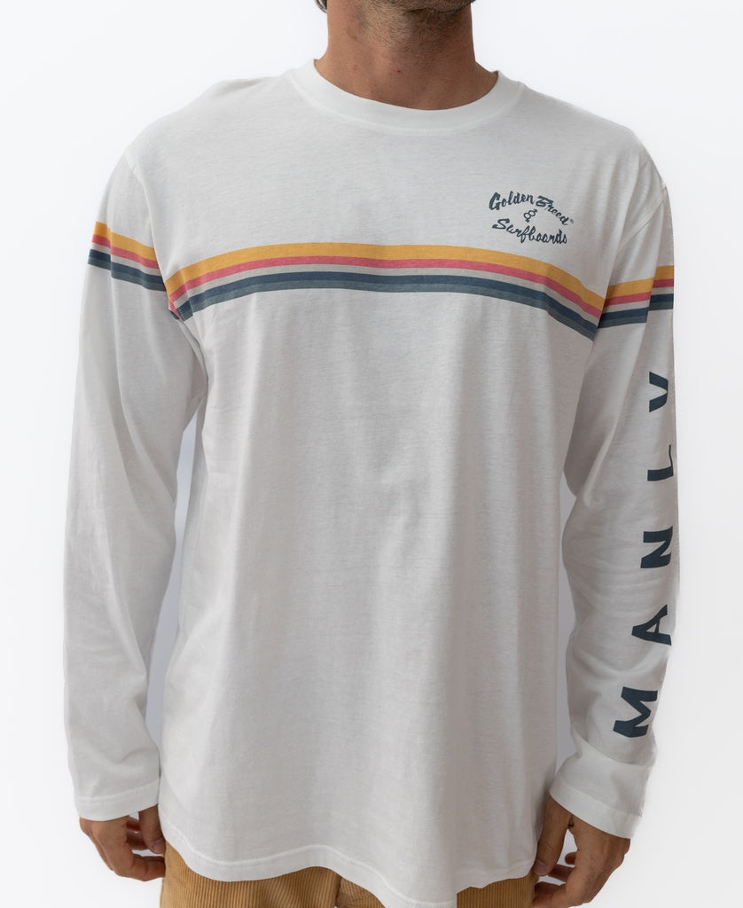 Man wearing the Golden Breed Manly Cali Long Sleeve Tee in off white, featuring bold red, yellow, and gray stripes across the chest and “MANLY” printed on the left sleeve. Made from 100% cotton jersey.