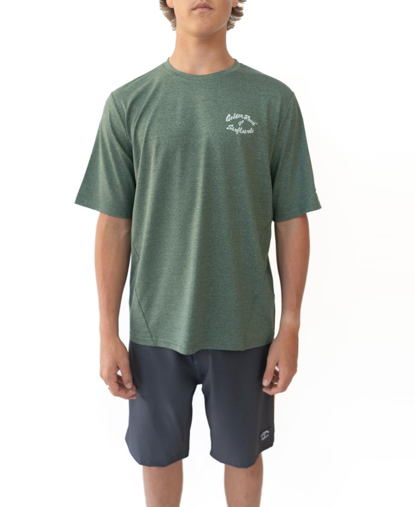 A person wears the Golden Breed Nemo S/S Rash Shirt in green marle with white chest text and dark gray shorts, standing against a white background.