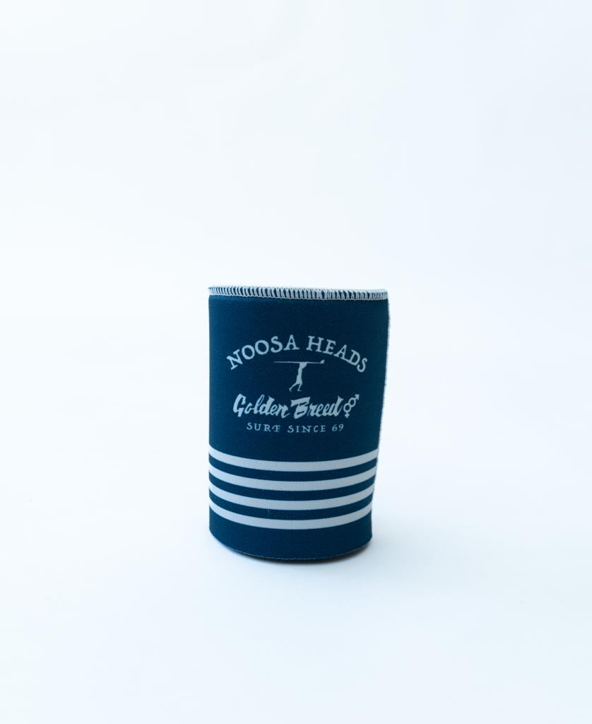 The Noosa Stubby Beach Boy | Navy by Golden Breed, featuring white stripes and Noosa Heads Golden Breed Co Surf Since 69 text, is displayed upright on a plain white background.