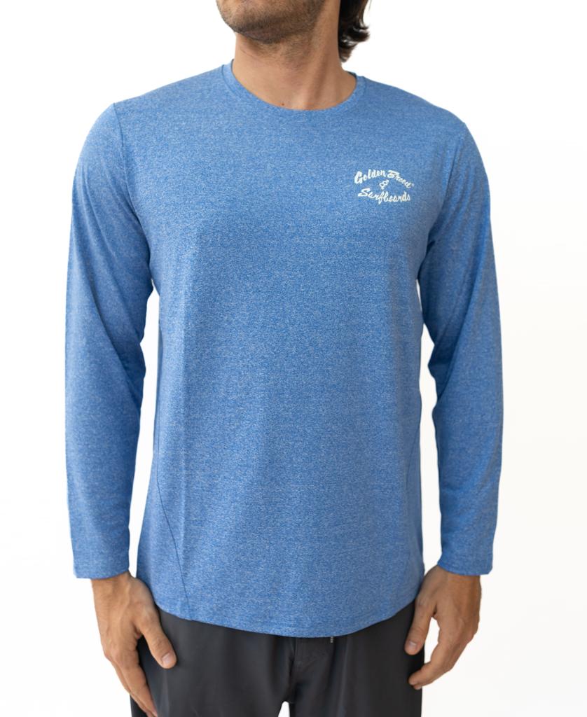 A man wears the Golden Breed Pebbles L/S Rash Shirt in Blue Marle, featuring UPF 50+ sun protection and a white chest logo, standing against a plain white background.