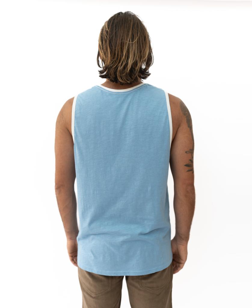 A person with shoulder-length hair is shown from the back, wearing a Golden Breed Retro Ringer Muscle Top in Azure Blue and light brown pants, set against a white background.
