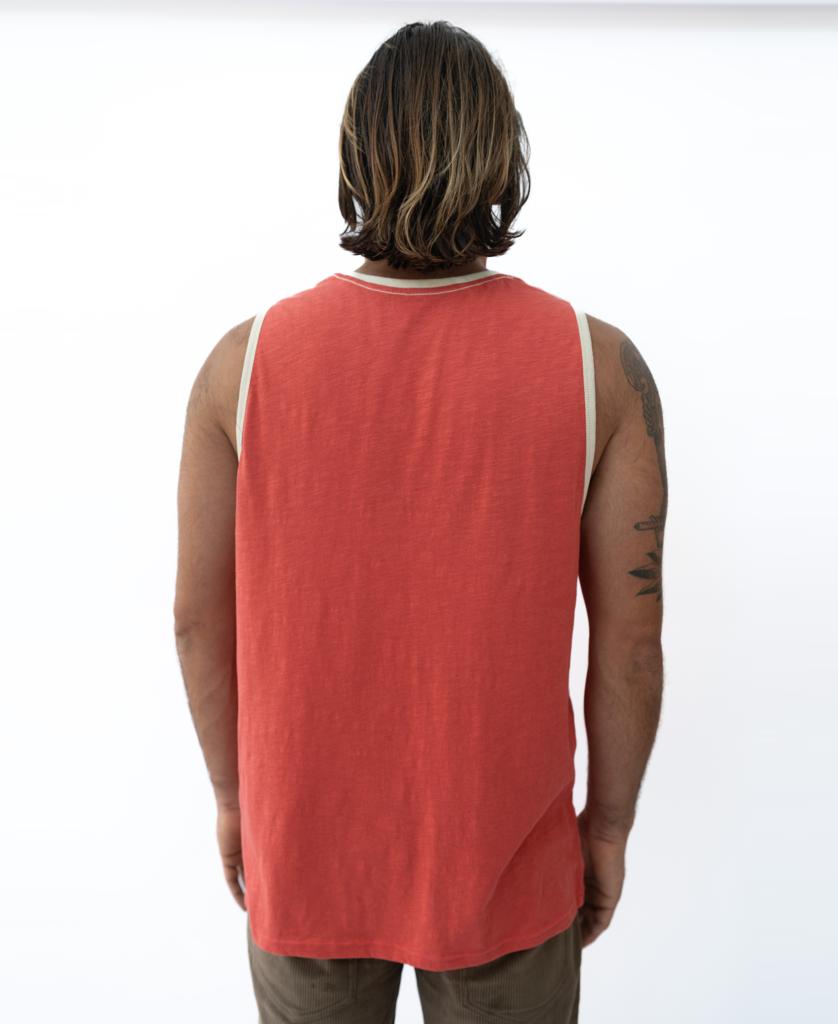 A person with shoulder-length hair is shown from the back, wearing the Golden Breed Retro Ringer Muscle Top in Wash Red and brown pants against a plain white background.