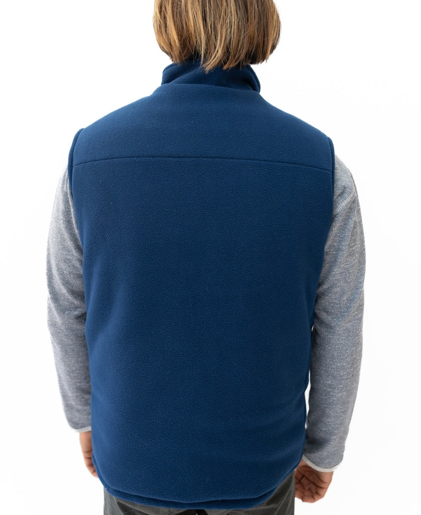 A person is shown from behind wearing the Golden Breed Thredbo Vest | Midnight over a gray long-sleeve shirt, set against a plain white background.