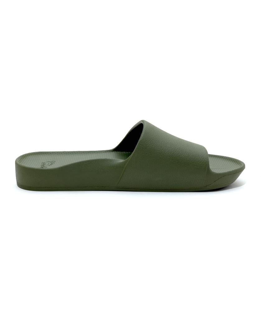 The Archies Archie Slide in Khaki is a single arch support sandal with a wide strap and flat sole, made from closed cell foam that molds to your foot, shown from the side against a white background.