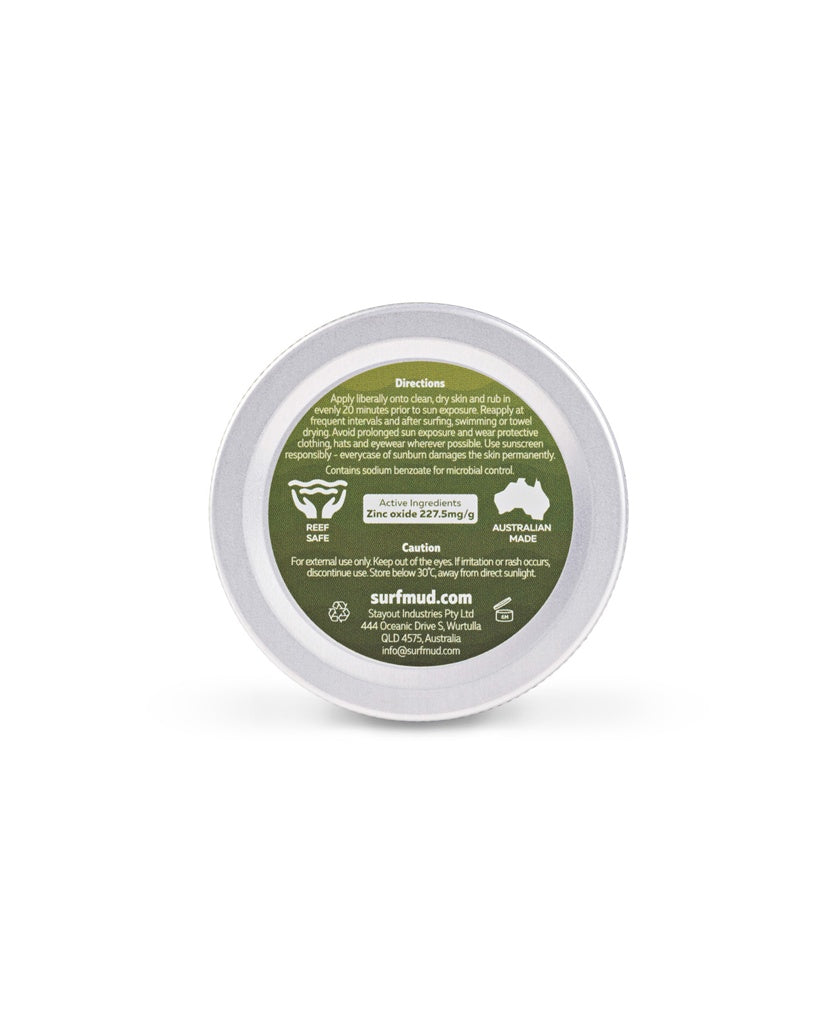 A round tin labeled green with directions, non-nano zinc oxide, cautions, and company info for Surf Mud Mineral Sunscreen Tin SPF50+ is shown.