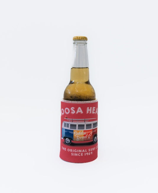 A beer bottle in the Noosa Stubby Kombi | Wash Red holder by Golden Breed, made from neoprene with a sublimated print: NOOSA HEADS, Golden Breed, THE ORIGINAL SURF CO. SINCE 1969 and a van graphic.