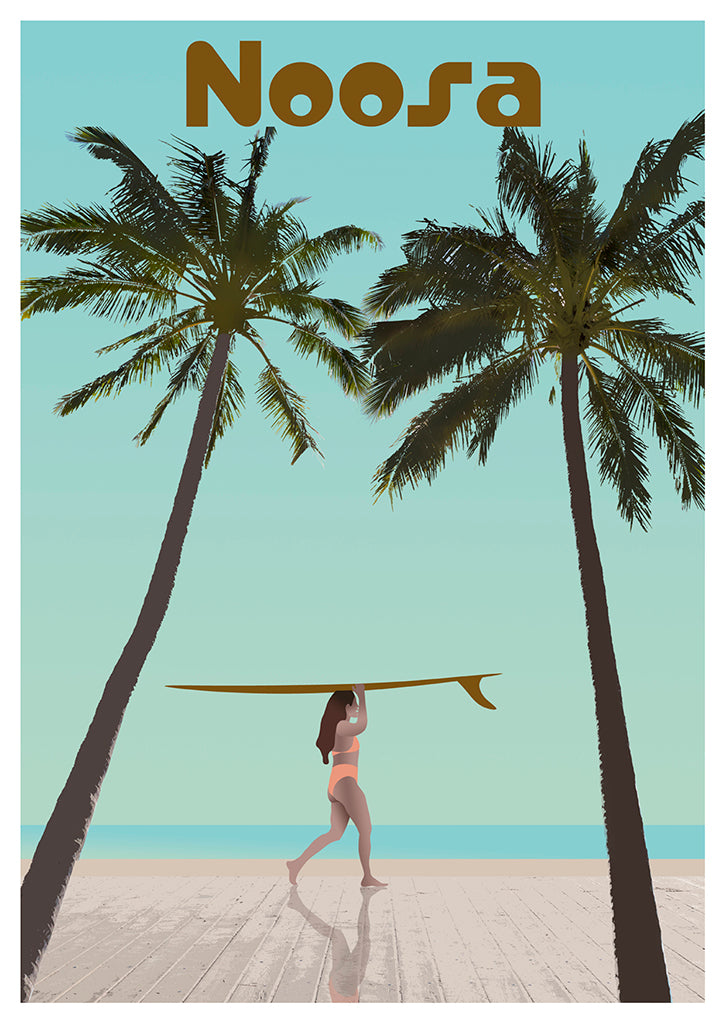 A woman in a swimsuit carries a surfboard across a sandy beach between palm trees, with Noosa above and the ocean beyond—capturing vintage surf vibes in the Let Me Sea Postcard Noosa Sum Palm.
