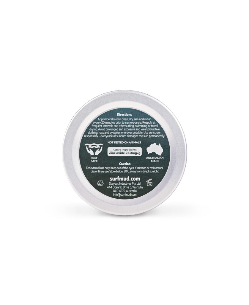 A round tin with a dark green label displays directions and info for Surf Mud’s Ocean Addicts Sunscreen Tin SPF30, made with non-nano zinc oxide, reef safe, cruelty free, Australian made—perfect for ocean sports.