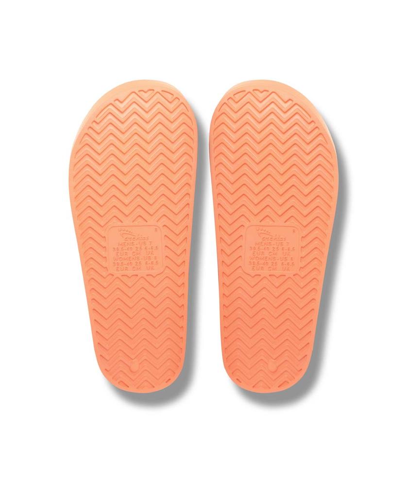 A pair of peach Archies rubber shoe soles with a herringbone tread and central textured rectangle, designed to complement your favorite Archies Archie Slide.