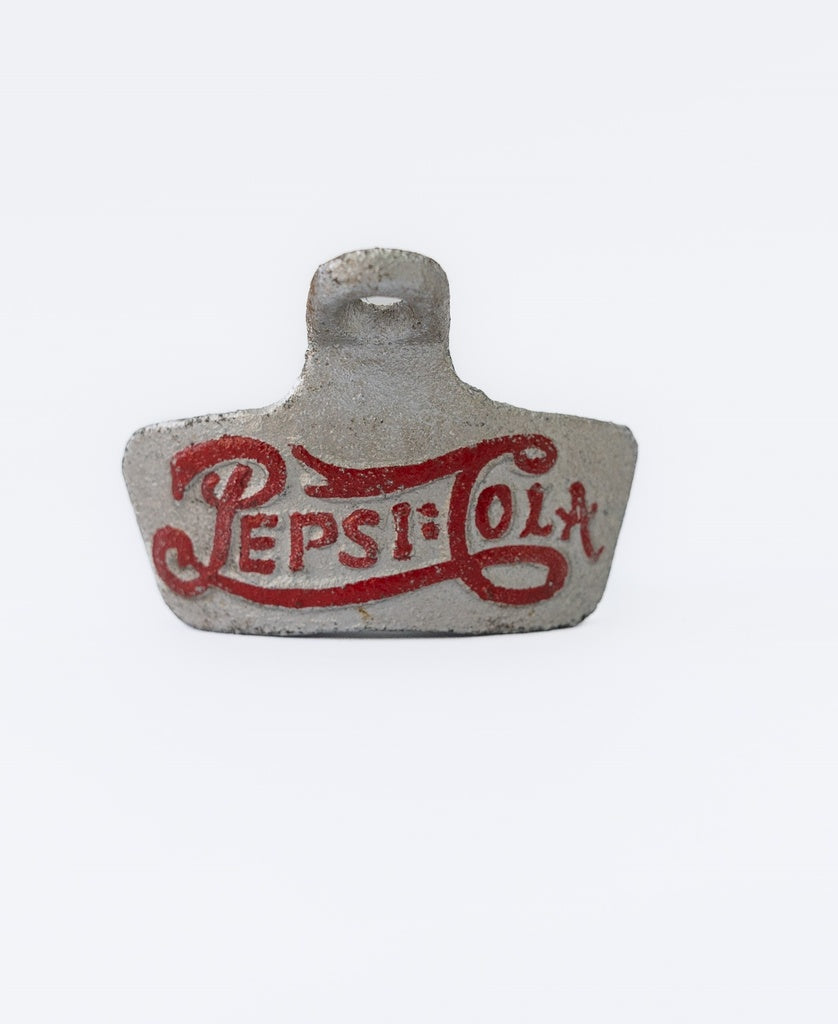 The Oshi Pepsi Bottle Opener Silver features a vintage-style red Pepsi-Cola logo on gray, shown against a plain white background.