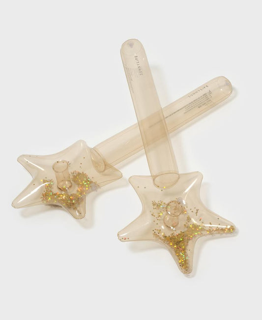 The Sunny Life Kids Inflatable Star Wand Princess Swan Gold Set of 2 includes two clear, cylindrical wands with shimmering gold glitter in star-shaped tops—perfect for imaginative pool play alongside other inflatable toys.