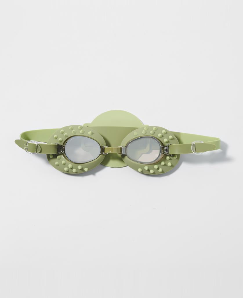 A pair of Sunny Life Kids Swim Goggles Cookie the Croc in khaki, featuring raised bumps around the eye rims and anti-fog lenses, shown against a white background.