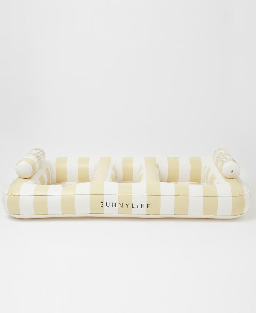 The Luxe Twin Hammock Float Mango Bay | Soft Mustard by Sunny Life features a golden mustard and cream stripe print, two backrests, and logo text—an oversized float ideal for relaxing against a plain white background.
