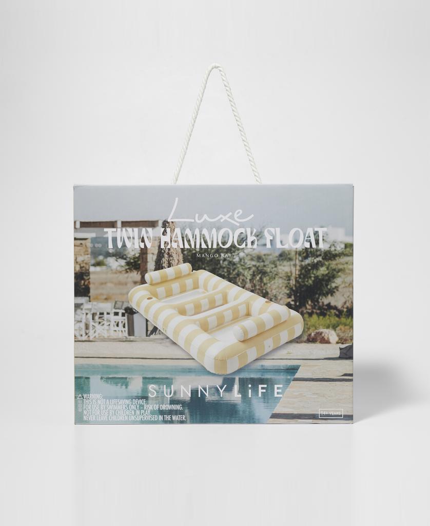 A product box featuring the Luxe Twin Hammock Float Mango Bay | Soft Mustard by Sunny Life, showing an oversized hammock float with golden mustard and cream maxi stripes.