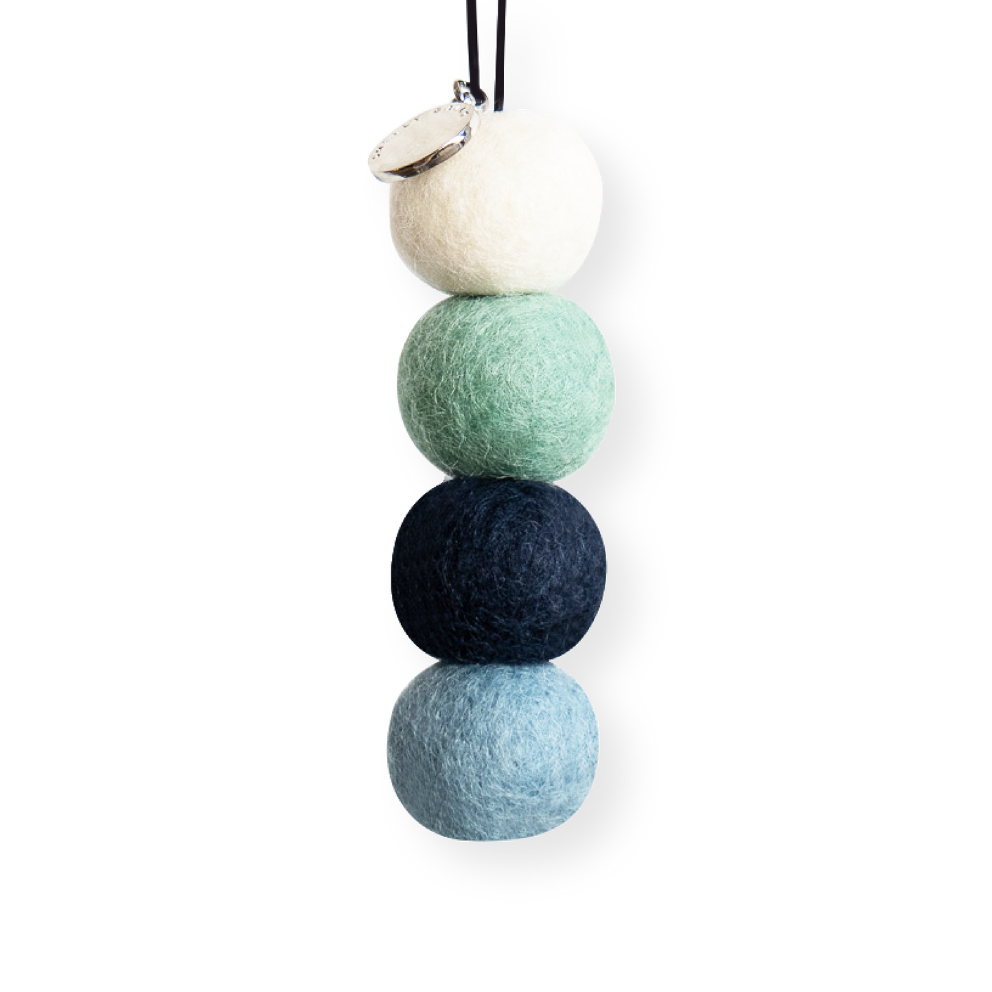 The Smelly Balls Cove Set Coastal Drift features four felted wool balls in white, green, dark blue, and light blue with a keyring—ideal for adding your favorite beach-inspired fragrance to your bag or keys.