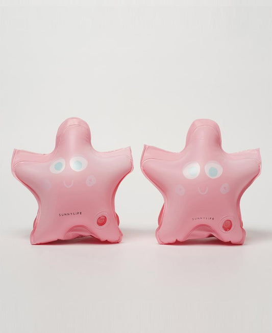 Two pink, starfish-shaped Melody the Mermaid Float Bands | Strawberry by Sunny Life, featuring smiling faces, are placed side by side on a white background—perfect swimming accessories for fun adventures.