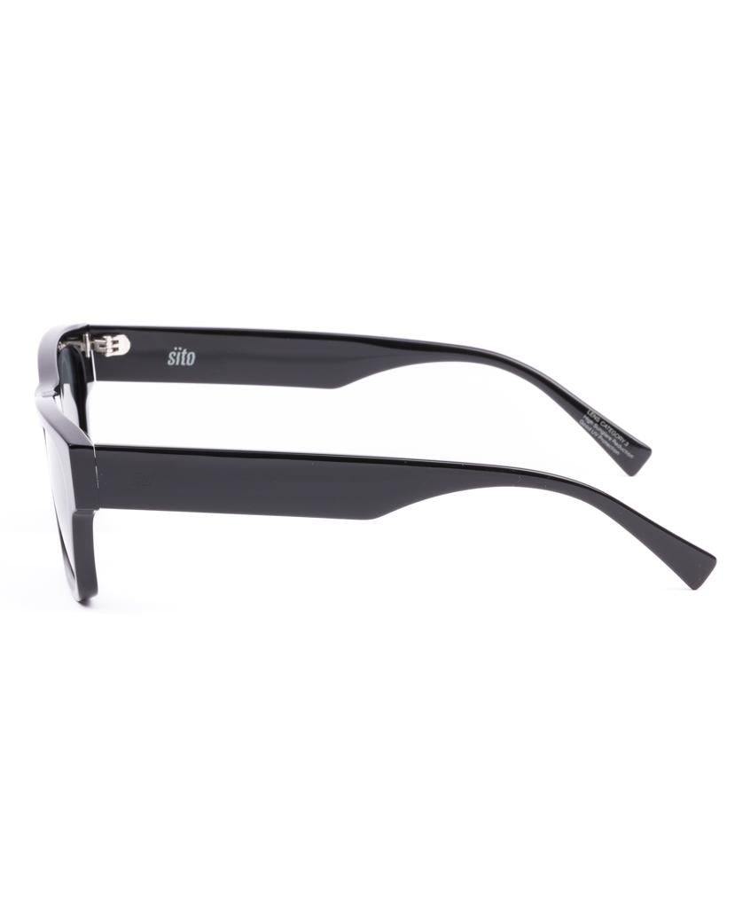 The Sito Boston | Black / Iron Grey Polar sunglasses feature a thick, plant-based acetate frame and offer high UV protection, shown from the side on a white background.