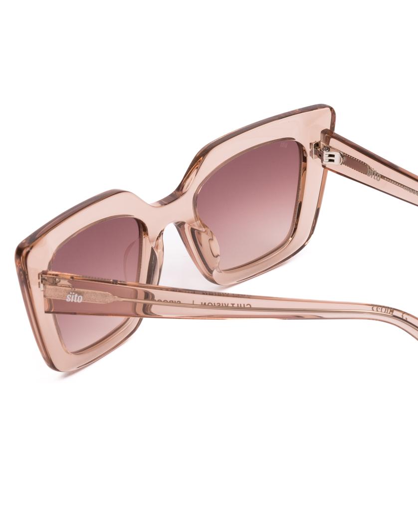 The Sito Cult Vision | Sirocco / Rose Gradient sunglasses feature translucent pink square frames made from plant-based acetate and gradient lenses, shown from a side angle against a white background.