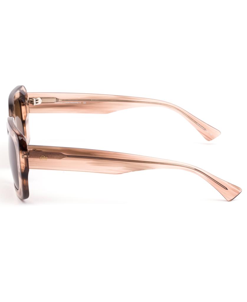 Side view of Sito Indi | Biscotti / Brown sunglasses with translucent light brown frames and dark lenses in a retro-inspired design, shown against a white background.