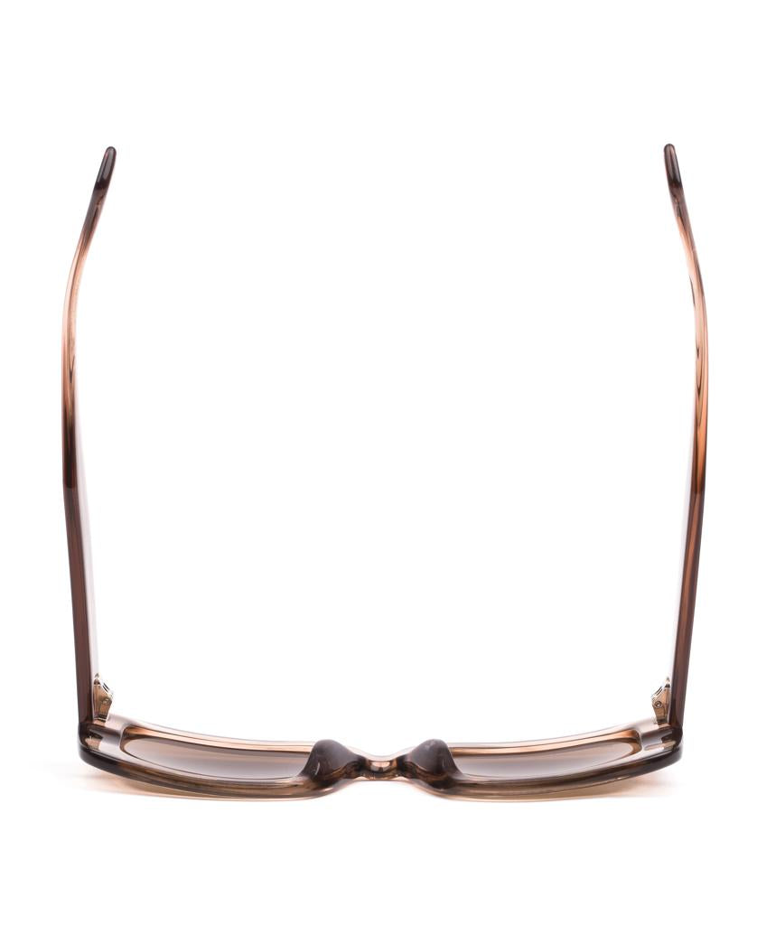 The Sito Indi eyeglasses in Biscotti/Brown showcase a retro-inspired front view with temples extended upward, set against a white background.