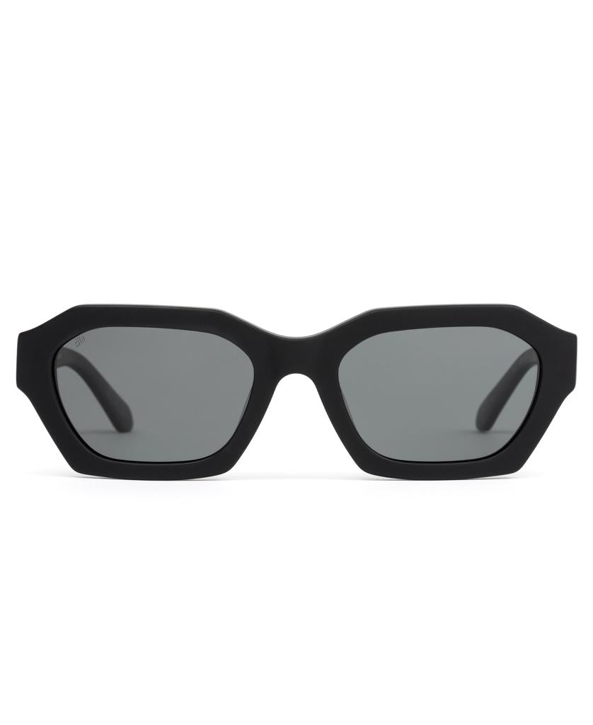 The Sito Kinetic sunglasses in Matte Black feature thick, plant-based acetate angular square frames and iron grey polarized lenses, displayed facing forward on a white background.