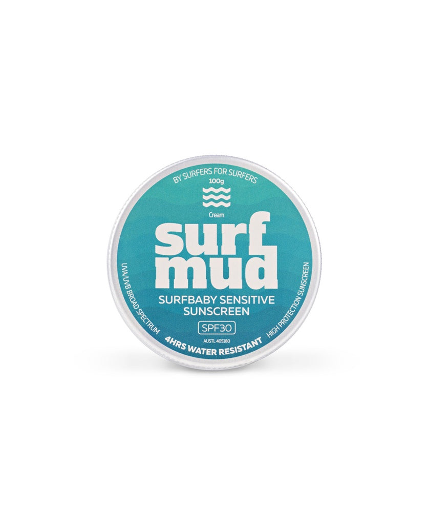 The Surf Mud SurfBaby Sensitive Sunscreen Tin SPF30 features a teal label with white text, is 4-hour water resistant, and uses non-nano zinc oxide for gentle mineral sun protection.