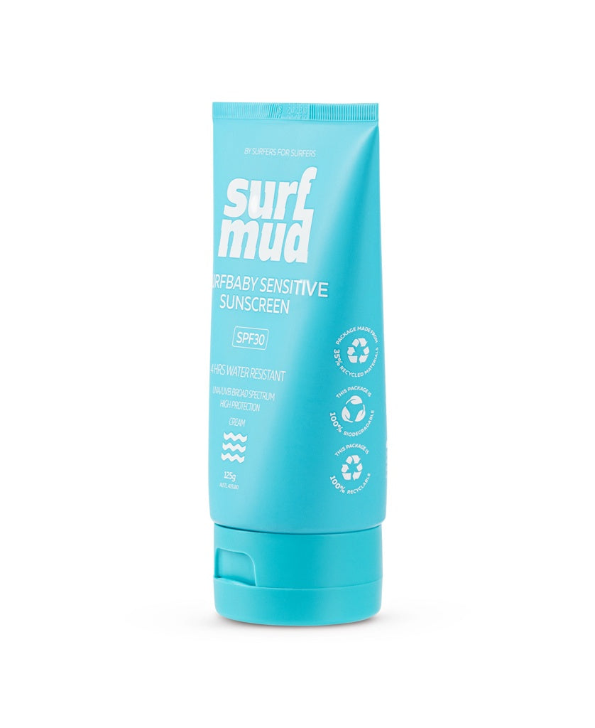 A blue tube of Surf Mud SurfBaby Sensitive Sunscreen SPF30, a mineral sunscreen with non-nano zinc oxide, water resistance, and natural ingredients icons, stands upright on a white background.