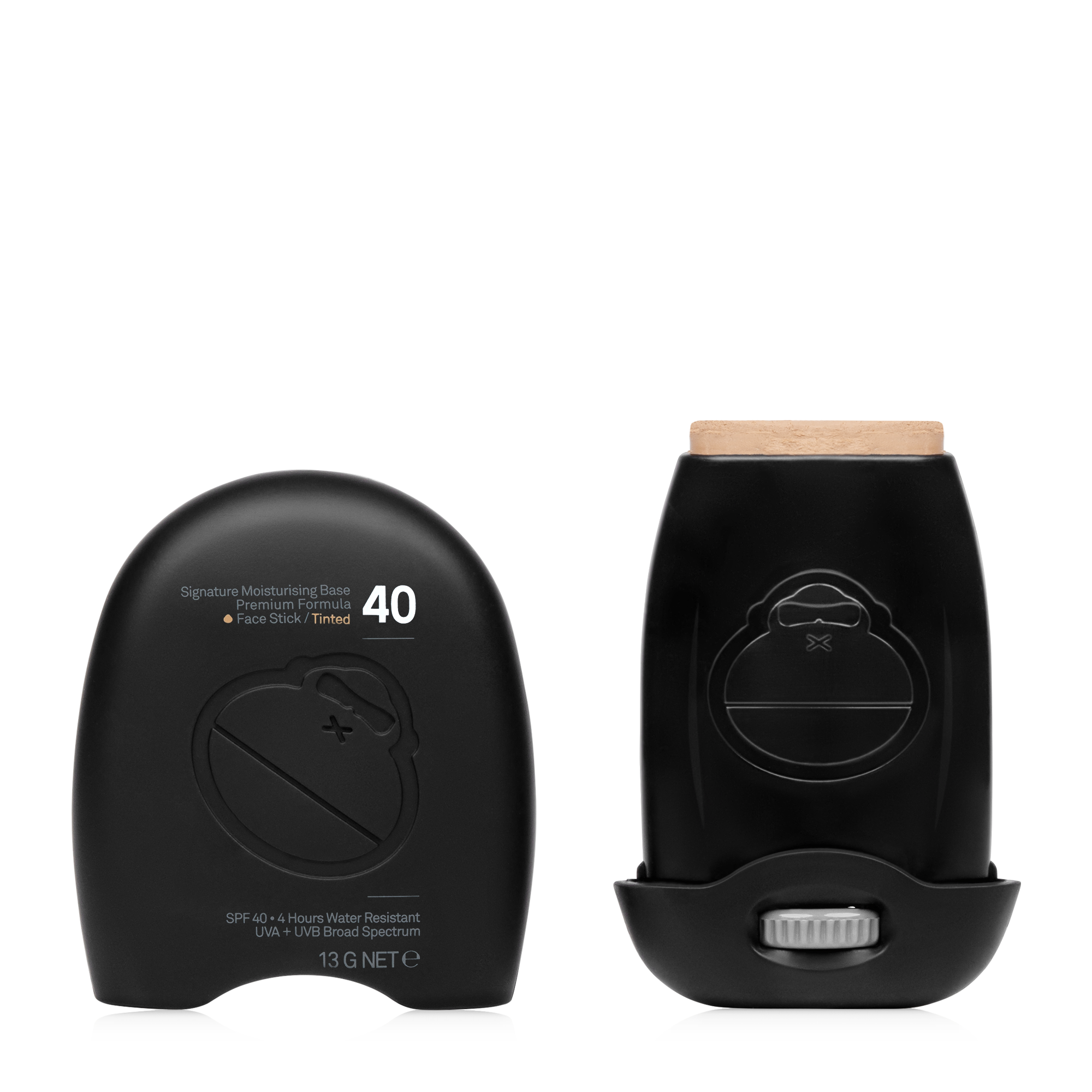 Two black Sun Bum Signature SPF40 Tinted Stick (13g) containers—one open to show the product—feature minimalist packaging. This mineral sunscreen provides broad spectrum facial protection.