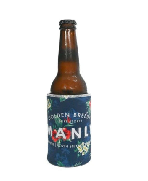A brown glass bottle in a blue floral-patterned Manly Stubby Aloha | Dark Navy holder by Golden Breed, shown on a white background.