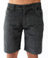 Waist-down view of a person wearing Golden Breeds Floyd Cord Walkshort in Wash Black, featuring 100% cotton corduroy, front pockets, and a structured waist with button closure, shown against a plain white background.
