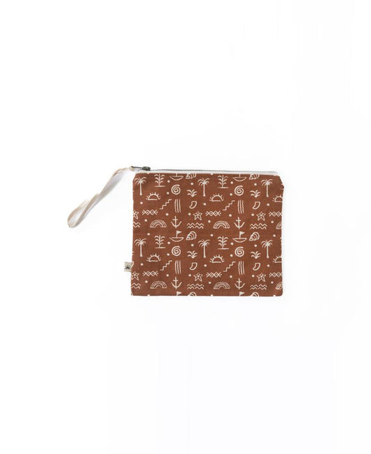 The Bomba WET BIKINI Sumba Alchemy is a brown, zippered pouch with wrist strap and white geometric pattern, featuring a waterproof interiorโideal as a Wet Bikini Bag for the beach. Displayed on a white background.