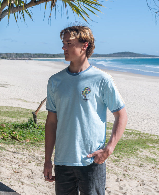 Golden Breed Flying Man Ringer Tee | Turquoise - T-Shirts
