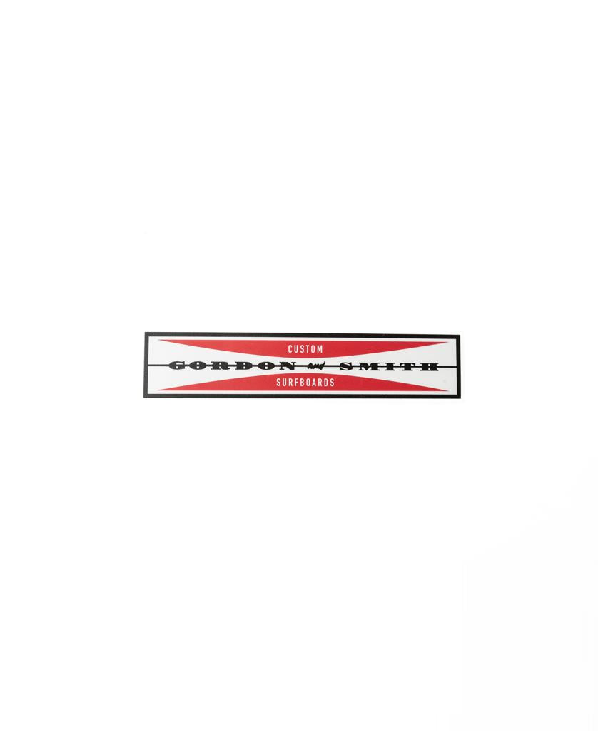 The G&S Skip Sticker 165mm | Red by Gordon & Smith is a high-quality rectangular sticker featuring red and black graphics and arrow designs on a white background. Made in Australia.