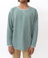 A person wearing the Golden Breed Classic Rag Top in Surf Green Marle and tan pants stands against a plain white background.