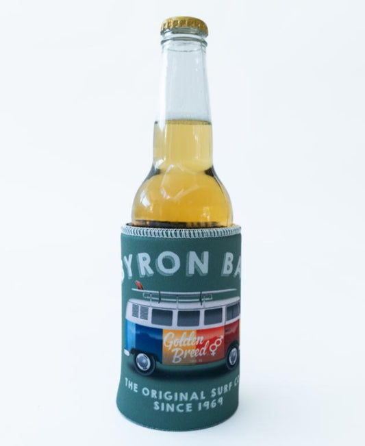 A light golden drink in the Byron Stubby Kombi | Surf Green holder by Golden Breed, featuring a colorful van with “Byron Bay” and “Golden Breed, The Original Surf Co. Since 1969” text.