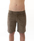 A person models the Golden Breed Floyd Cord Walkshort in Wash Brown, featuring a structured waist, standing against a white background and shown from the waist to above the knees.