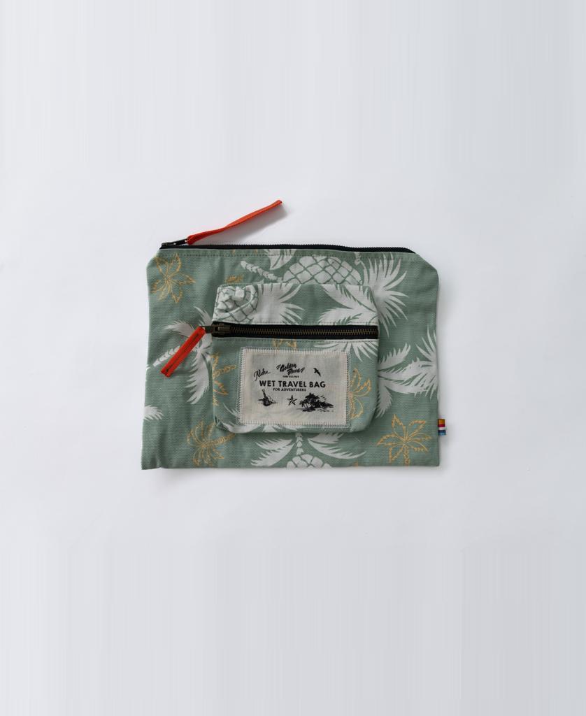 The Marco Wet Travel Bag | Sage by Golden Breed is a green patterned, water-resistant pouch with a small front pocket, zipper closures, and a “WET TRAVEL BAG” label, photographed on a plain light background.