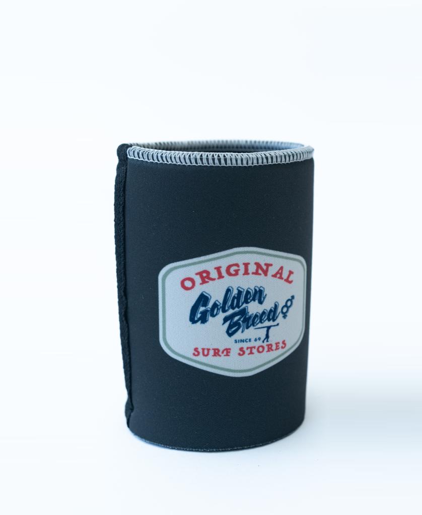 The Golden Breed Ray Stubby Holder in Wash Black is a neoprene holder with a patch that says Original Golden Breed Surf Stores in blue, red, and white.