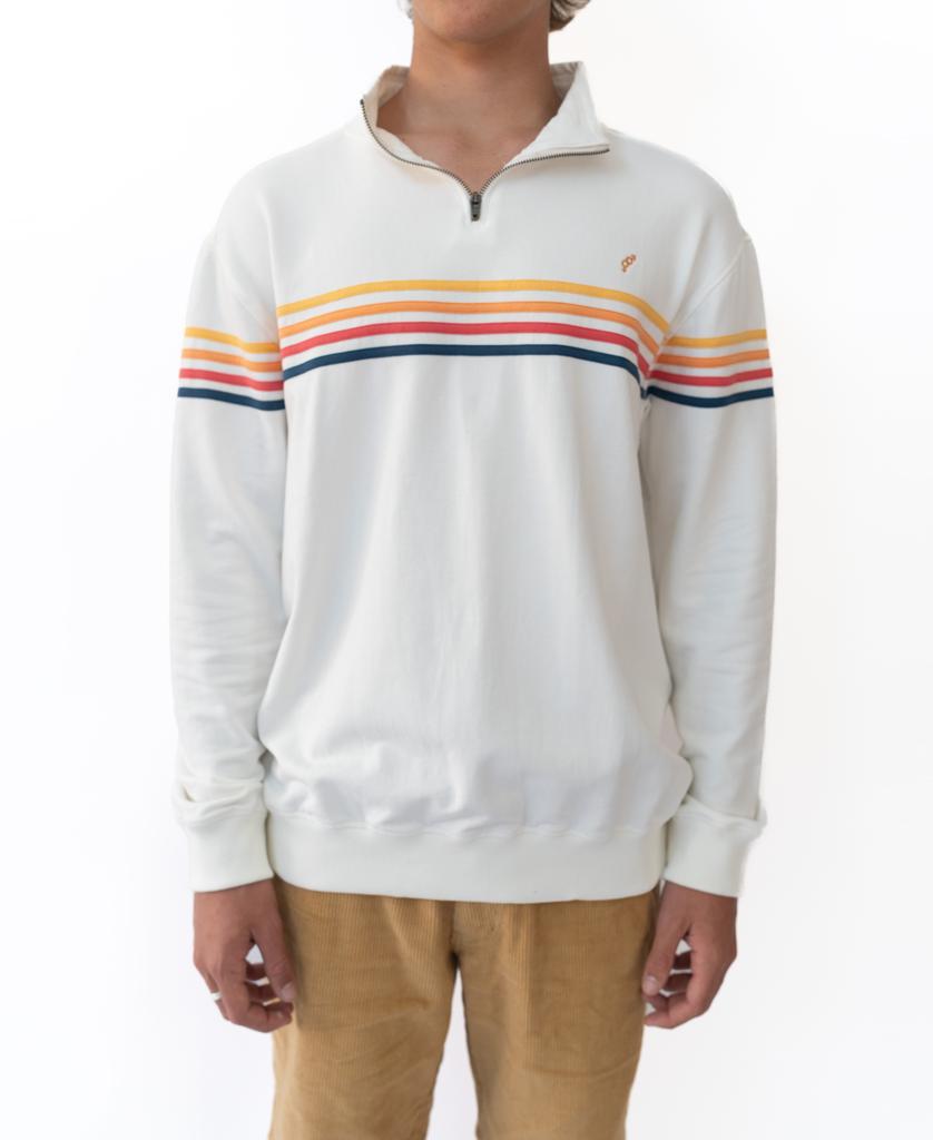 Someone wears the Golden Breed Long Island Fleecy Top in Off White—a quarter-zip sweatshirt with orange, yellow, and blue stripes—paired with light brown pants, standing against a plain white background.