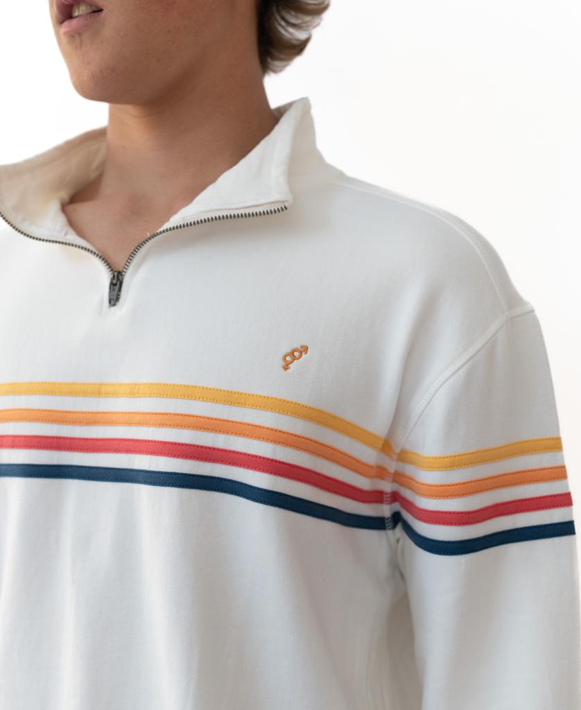 Someone wears the Golden Breed Long Island Fleecy Top in Off White—a zip-up pullover made from Bamboo/Cotton/Spandex, with orange, yellow, red, and navy chest stripes plus an embroidered orange logo.