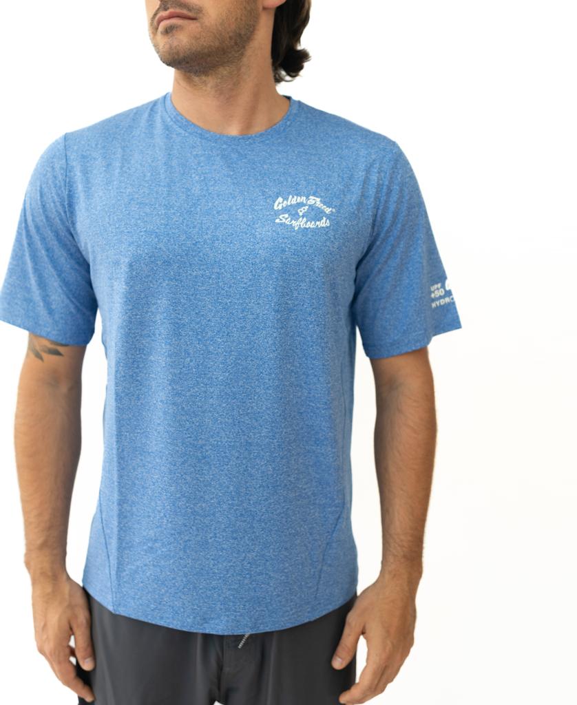 Man wearing the Golden Breed Nemo S/S Rash Shirt in Blue Marle, featuring UPF sun protection and white text on the chest and sleeve, standing against a plain white background.