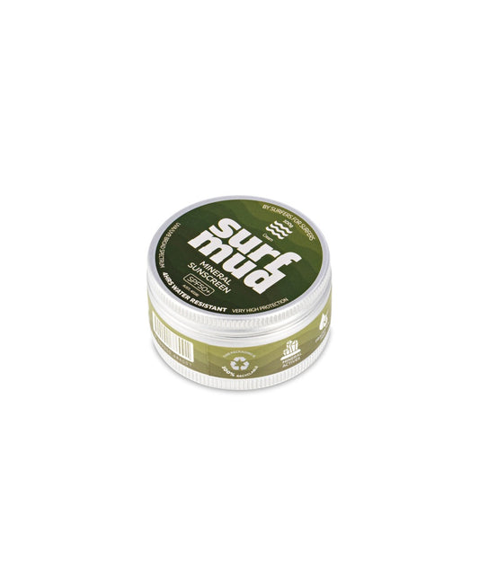 A round green Surf Mud Mineral Sunscreen Tin SPF50+ features icons for sun protection and recyclability and highlights its non-nano zinc oxide formula.