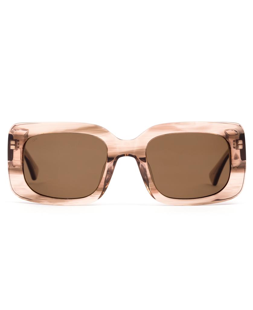 Front view of Sitos Indi sunglasses in Biscotti/Brown, showcasing an oversized square retro design with light brown translucent frames and brown tinted lenses.