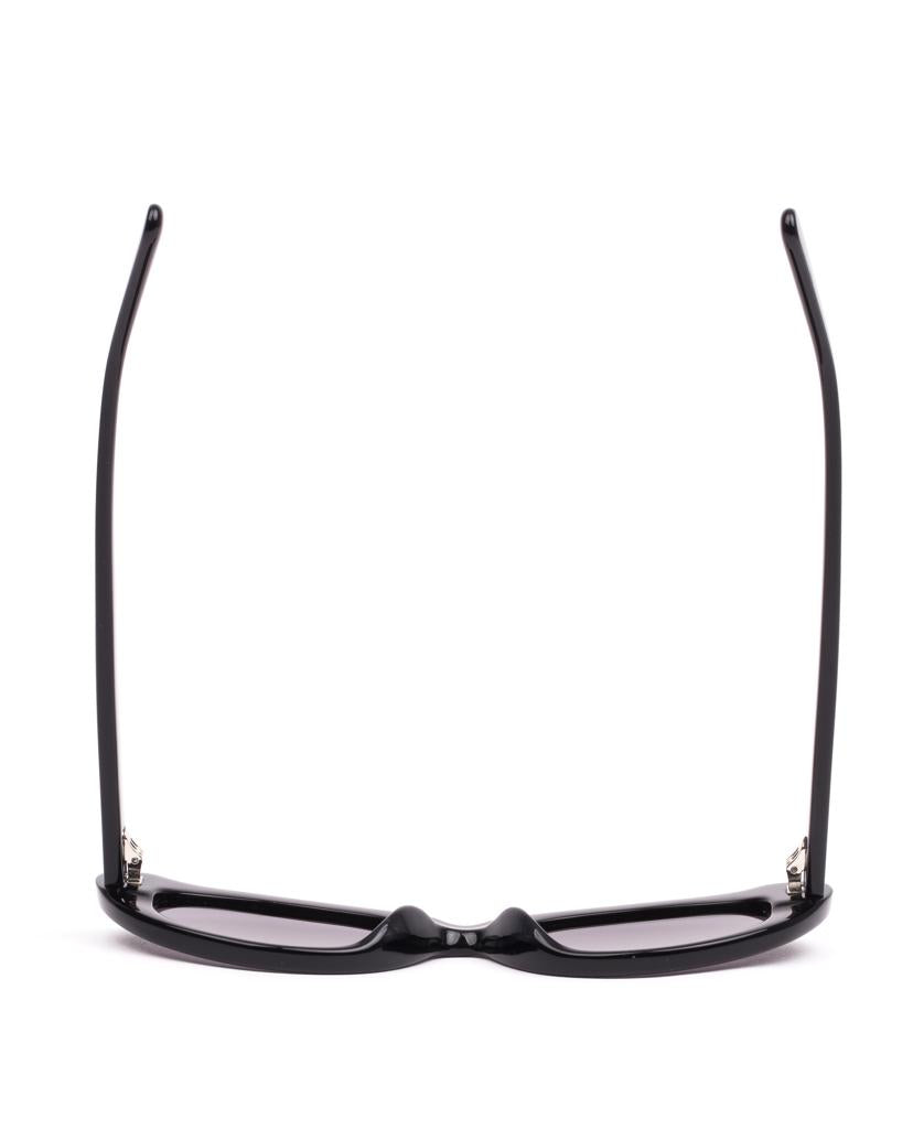 The Sito Siena sunglasses in black with smokey grey lenses are displayed upside down with extended temples, set against a white background.