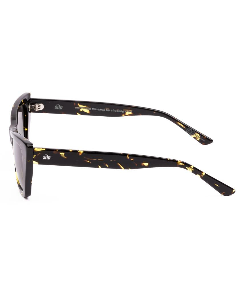Side view of Sitos Wonderland | Limeade Tort / Horizon Gradient Polar frames, made from plant-based acetate in black with yellow tortoiseshell pattern and high quality lenses, shown against a white background.